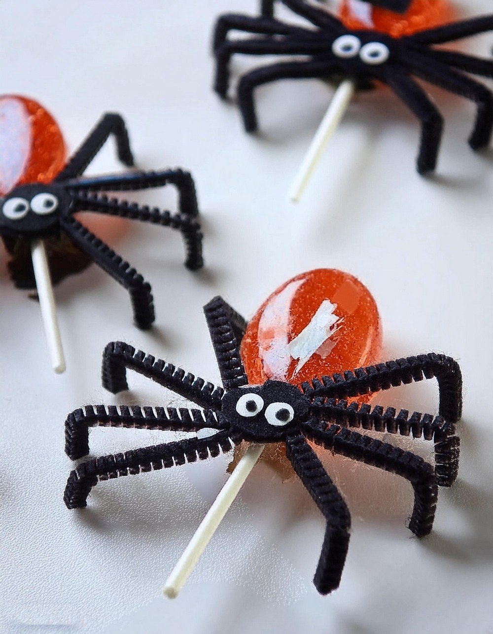 Transform Lollipops into Rustic Black Spiders