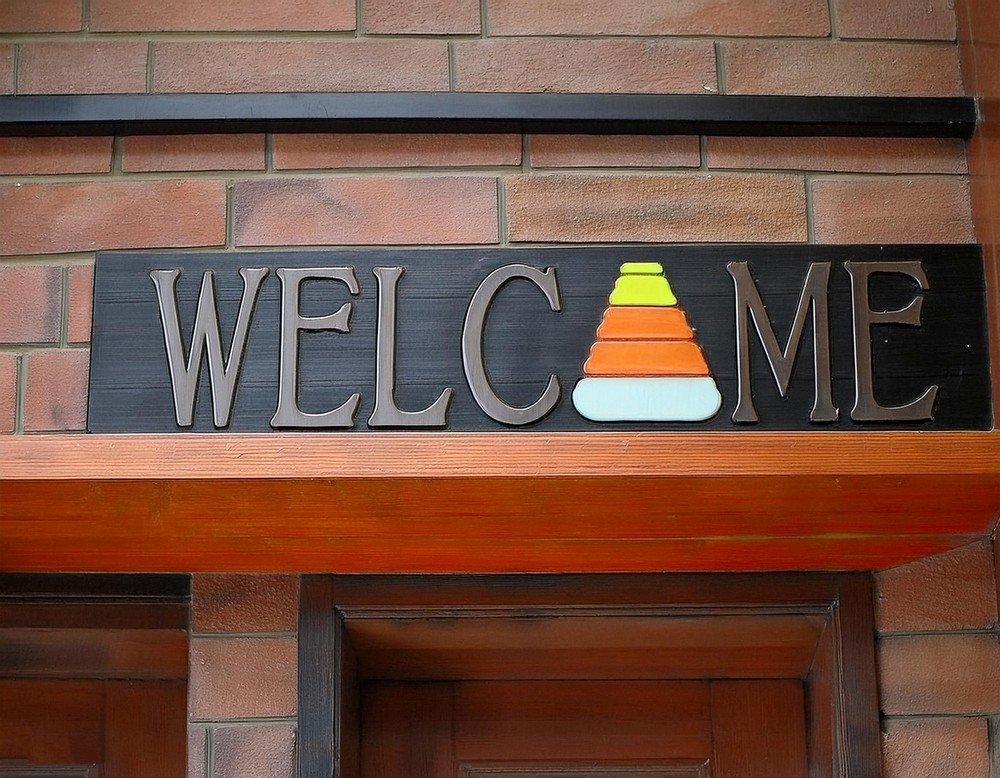 Welcome Guests with a Rustic Candy Corn Sign