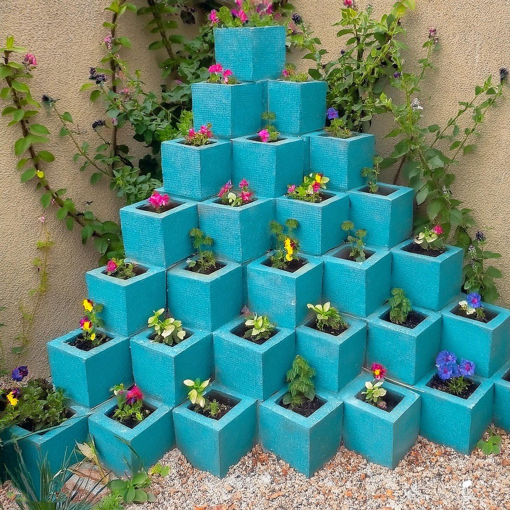 A Pyramid Garden With Blue Cinder Blocks