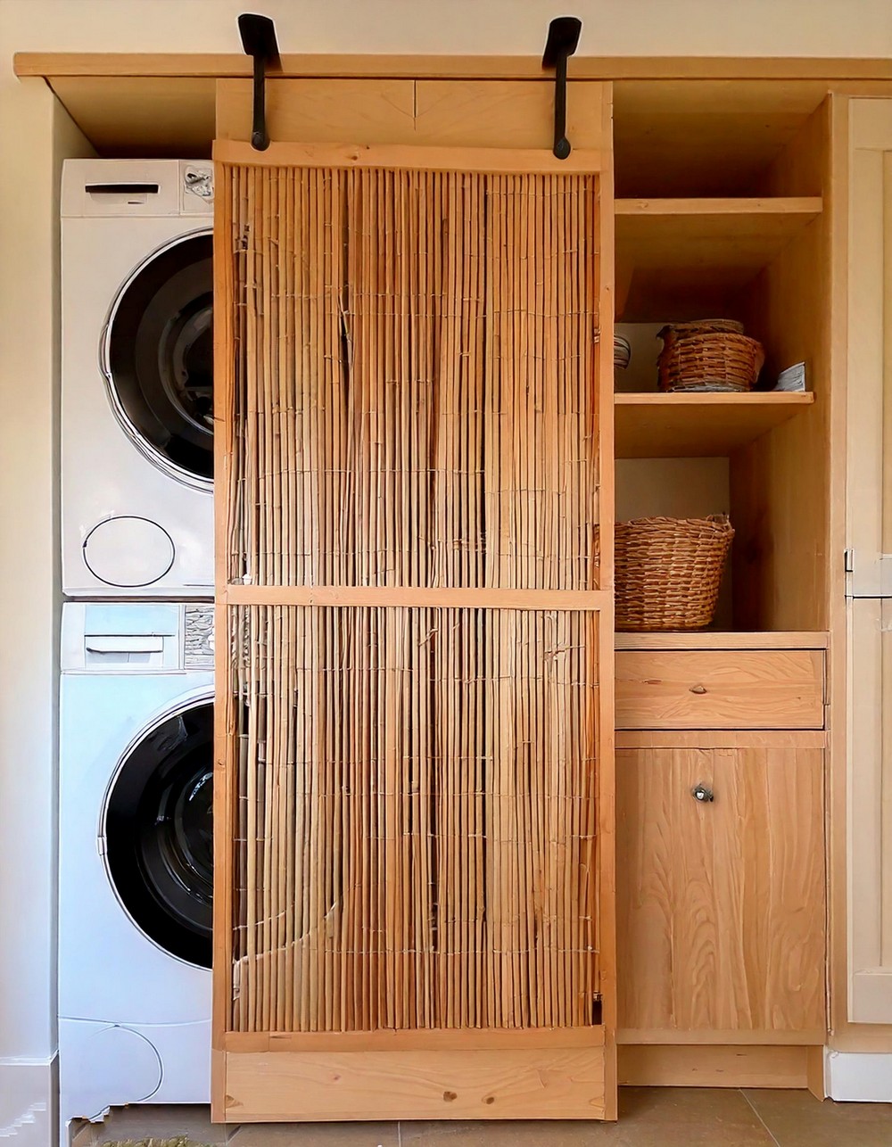 Minimalist Sliding Barn Door Laundry Room With A Stacked Washer Dryer